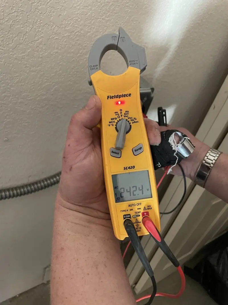 Voltage testing with clamp meter during Generator Installation in Blair